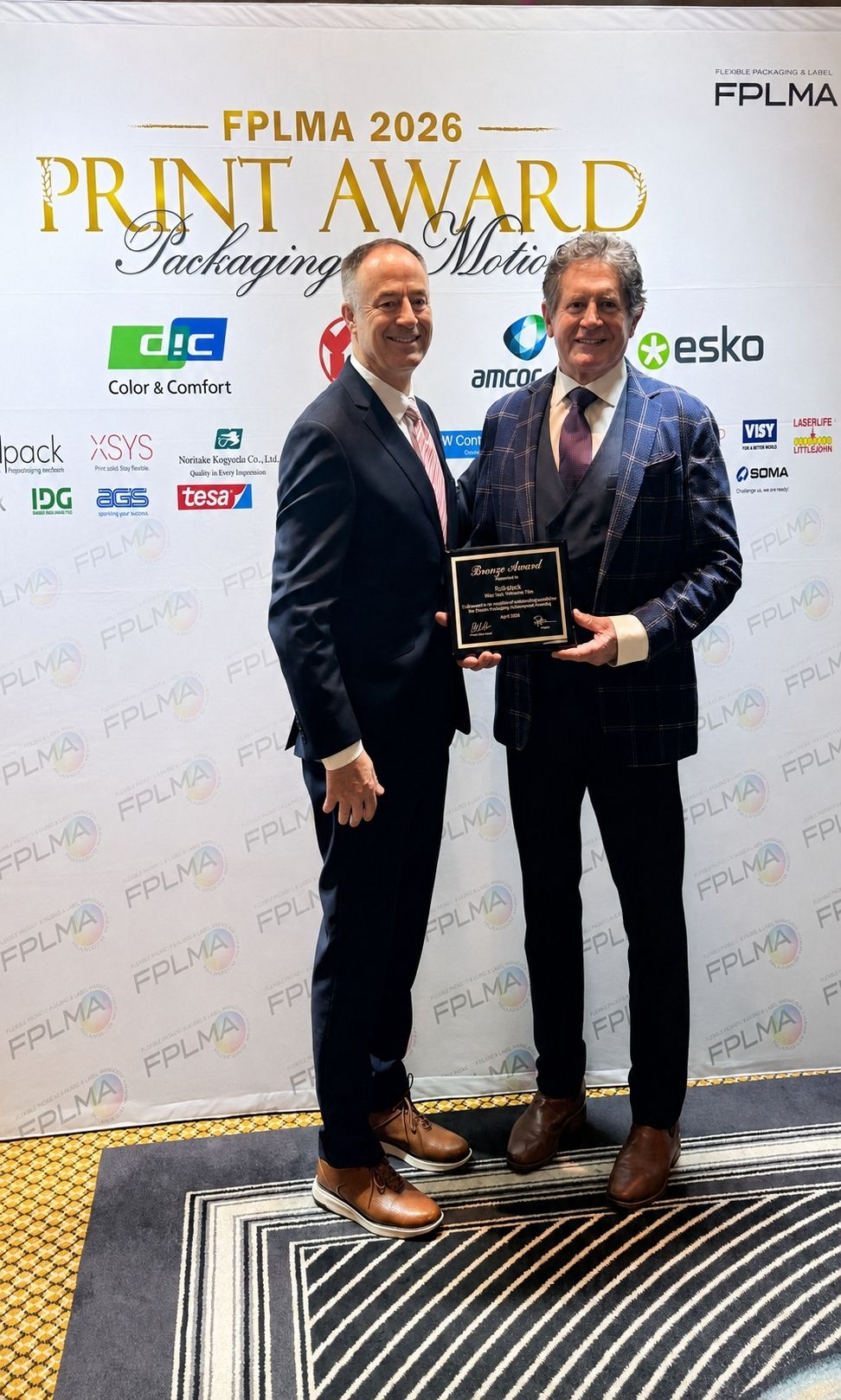 Phillip Rolls receiving RollsPack’s 2026 FTA Excellence in Flexography Bronze Award.